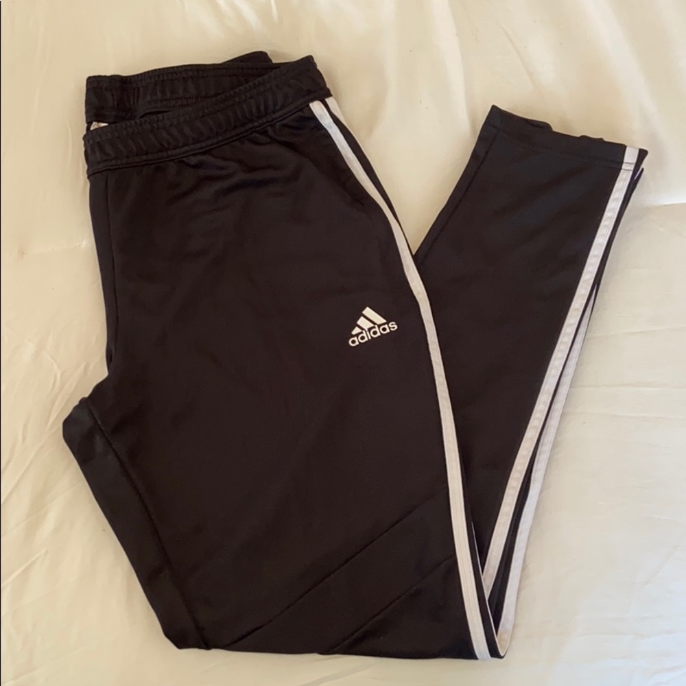 Women’s Adidas sweatpants in black.